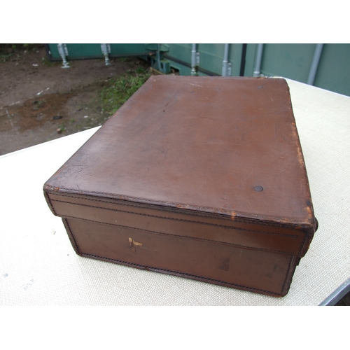 554 - Five vintage leather suitcases, the largest 70cms (5).