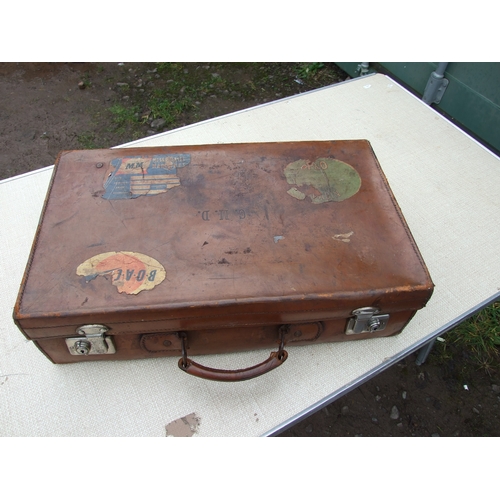 554 - Five vintage leather suitcases, the largest 70cms (5).