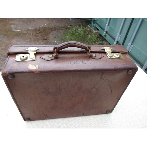 554 - Five vintage leather suitcases, the largest 70cms (5).