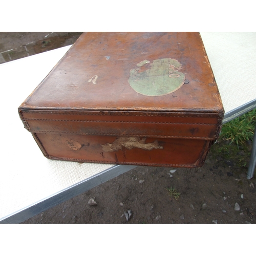 554 - Five vintage leather suitcases, the largest 70cms (5).