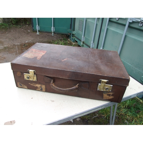 554 - Five vintage leather suitcases, the largest 70cms (5).