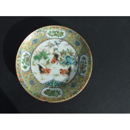 730 - A Chinese famille rose dish decorated with chickens, 14cms diameter; together with a similar bowl de... 