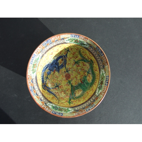 730 - A Chinese famille rose dish decorated with chickens, 14cms diameter; together with a similar bowl de... 