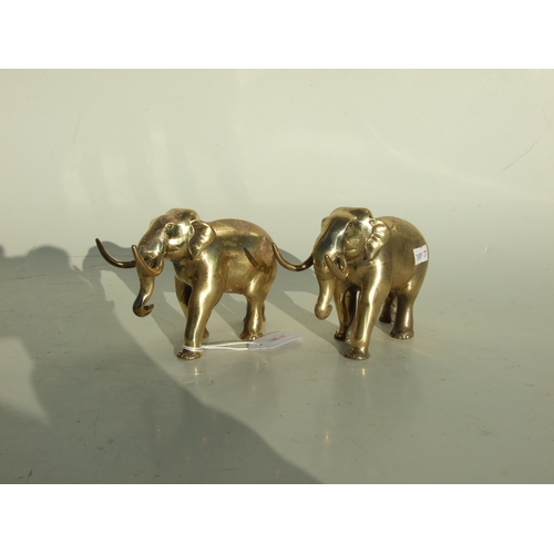 501 - A pair of elephant form pen rests, 14cms long.