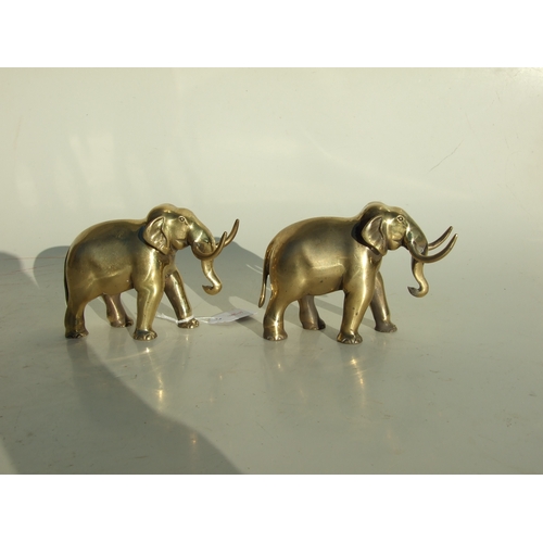 501 - A pair of elephant form pen rests, 14cms long.