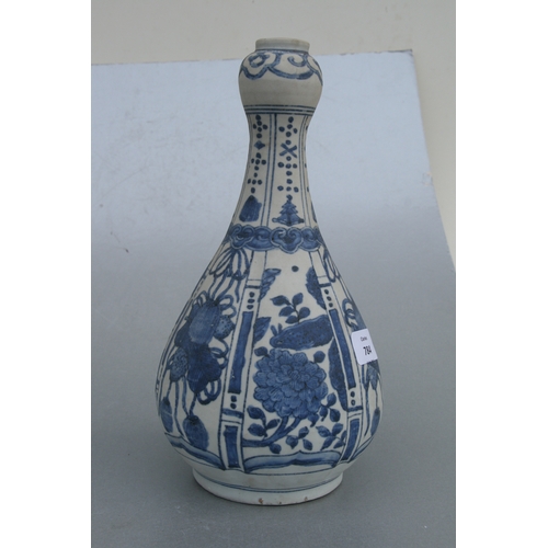 784 - A Chinese blue & white baluster vase decorated with flowers and precious objects, 29cms high.