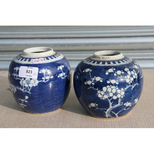 821 - A pair of Prunus cracked ice ginger jars, 13cms high (lack covers) (2).