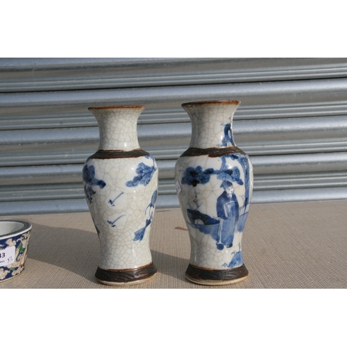 843 - A pair of Chinese blue & white crackle ware vases decorated with flowers, incised mark to the unders... 