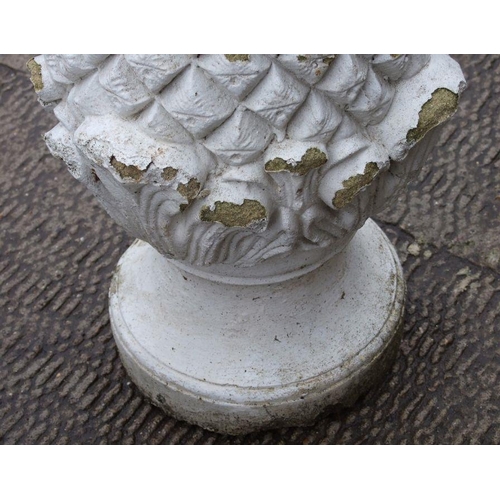 10 - A pair of well weathered painted reconstituted stone pineapple finials, 60cms high (2).