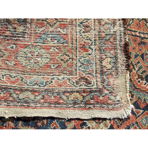 114 - A Persian Kellah runner with repeating geometric pattern on a red ground, 472 by 174cms.