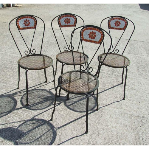 12 - A set of four metal garden chairs with tiled backs (4).