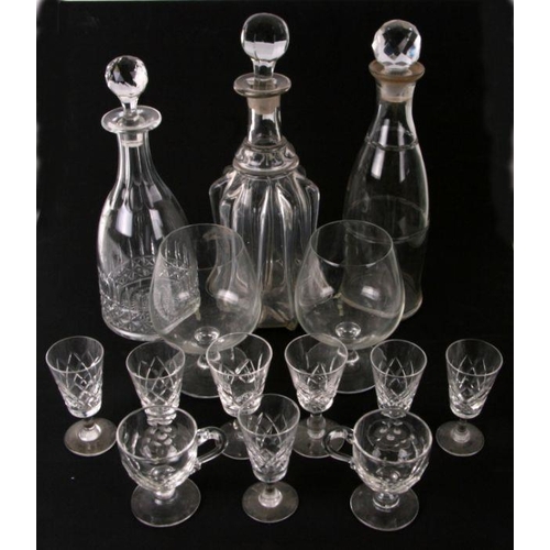 229 - A mallet shaped glass decanter, 33cms high; together with two other decanters and stoppers and assor... 