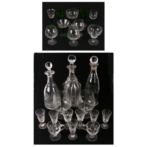 229 - A mallet shaped glass decanter, 33cms high; together with two other decanters and stoppers and assor... 