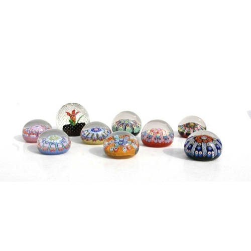 242 - A collection of nine paperweights to include Strathern and Caithness millefiori examples (9).