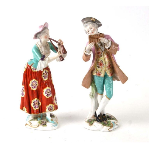 270 - A pair of continental porcelain figures depicting a male and female musician, the largest 27cms high... 