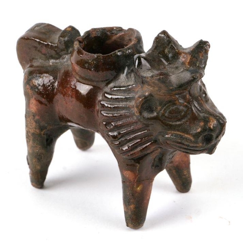 276 - A glazed pottery vessel in the form of a lion wearing a crown (possibly 18th century), 9cms high.