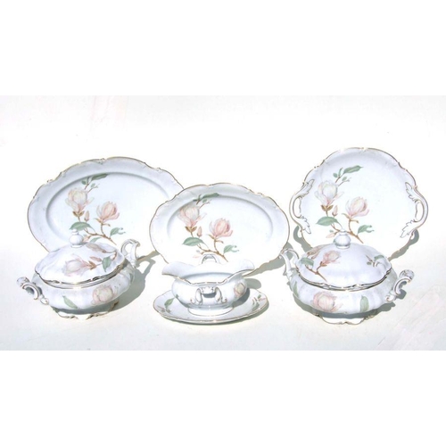 283 - An extensive  Hutschenreuther Selb Bavarian tea and dinner service decorated Magnolias.