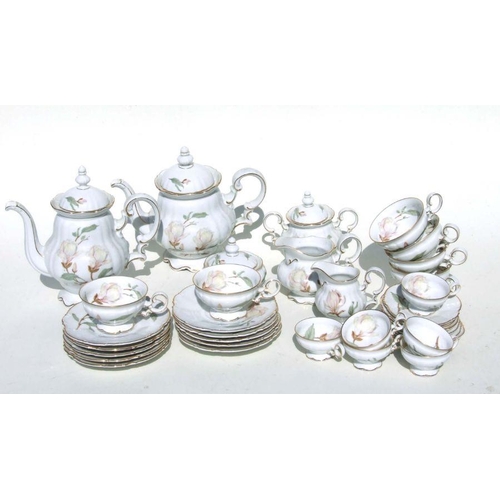 283 - An extensive  Hutschenreuther Selb Bavarian tea and dinner service decorated Magnolias.