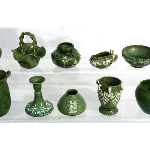 290 - A quantity of early Rye Pottery green glazed miniature dolls house vases, jugs, baskets and similar ... 