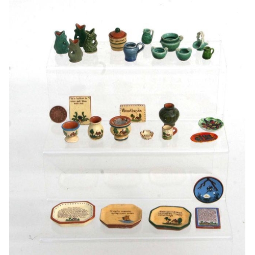 292 - A quantity of miniature doll's house ceramics to include Watcombe Motto ware and Rye Pottery items.