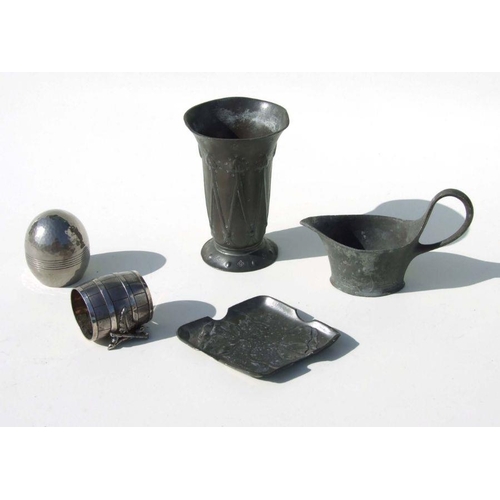 314 - A quantity of pewter items to include an Art Nouveau Liberty style flared beaker, 14cms high; a simi... 