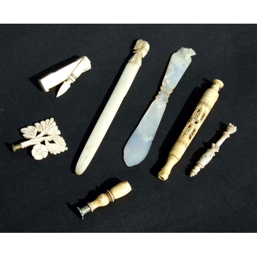 323 - A quantity of 19th century ivory and bone pipe tappers, Stanhopes and a mother of pearl letter opene... 