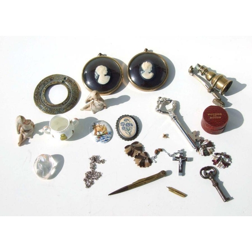 325 - A quantity of collector's items to include cameo miniatures, bisque figures, keys and other items.