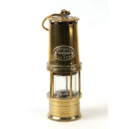 338 - A W E Teale & Co brass miner's lamp, 25cms high.