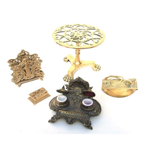 347 - A cast brass double inkwell desk stand, 21cms wide; together with a brass desk blotter; a brass two-... 