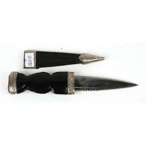 36 - A Scottish Sgian Dubh, the blade signed 'J Nowill & Sons Ltd, in a leather scabbard, 20cms long;... 