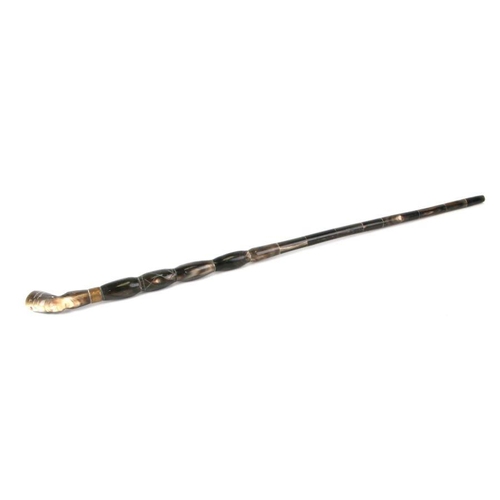 374 - A sectional horn walking stick with Egyptian head terminal, 94cms long.