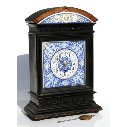 417 - A 19th century mantle clock, the blue & white enamel dial with Arabic numerals, in a dome topped... 