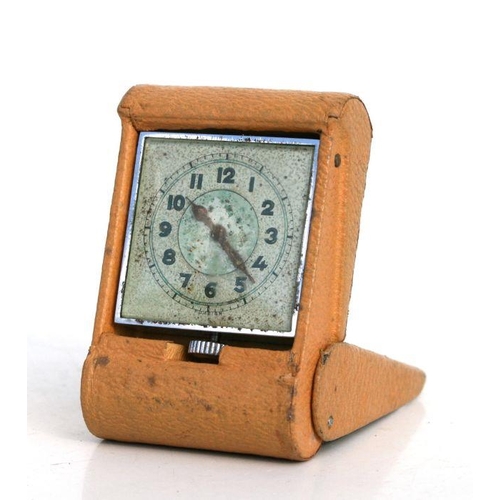 418 - An Art Deco leather cased travel clock, 5 by 7cms.