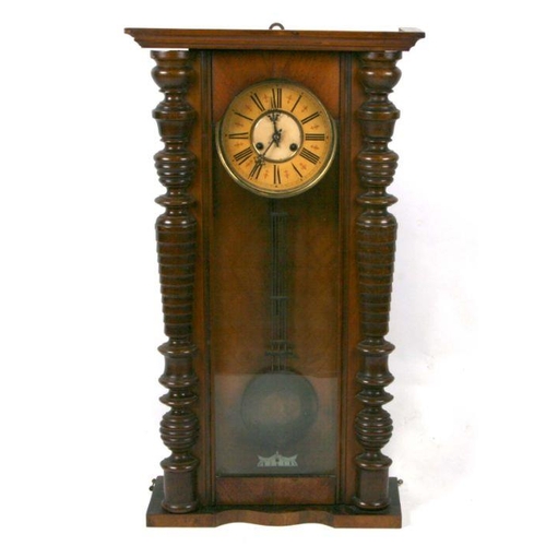 419 - A Vienna style wall clock in a walnut case, 44cms wide.