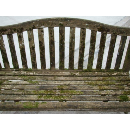 5 - An Alexander Rose well weathered teak garden bench, 149cms wide.