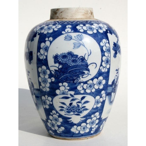 527 - A Chinese blue & white jar and cover decorated with figures within panels on a prunus ground, 27... 