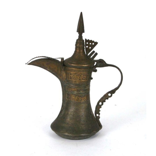 538 - A Turkish / Islamic brass dallah coffee pot, 33cms high.