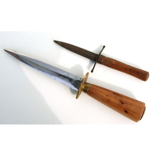 54 - A late 19th century stiletto dagger with brass crossguard and octagonal wooden hilt, having a blade ... 