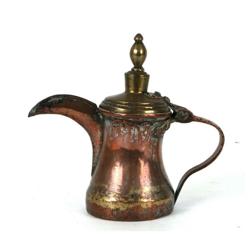 540 - A Turkish / Islamic copper and brass dallah coffee pot, 18cms high.