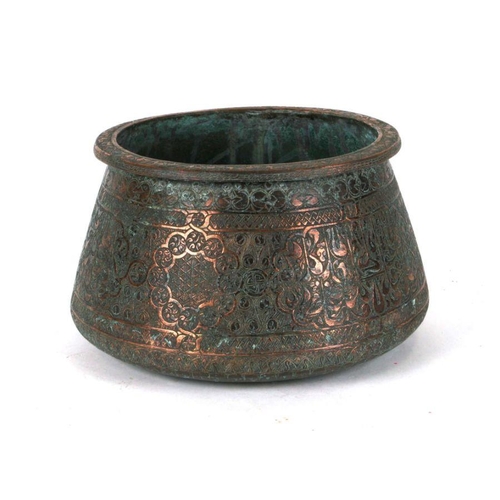 542 - An Indo / Persian copper palm pot highly decorated with foliate scrolls, 16cms high.