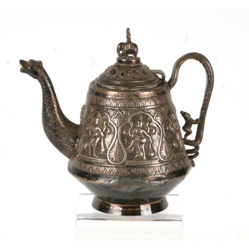 544 - An Asian white metal teapot decorated in relief with figures and having a dragon spout and elephant ... 