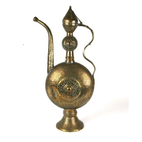 545 - A large Turkish / Islamic brass ewer, 63cms high.