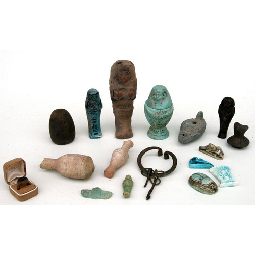 551 - A group of Egyptian antiquities and later items to include Scarab beetle, Shabti figures and burial ... 