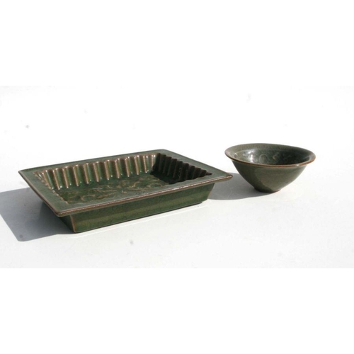 555 - A Chinese Ge ware rectangular dish, 18cms wide; together with a similar bowl, 10cms diameter (2).