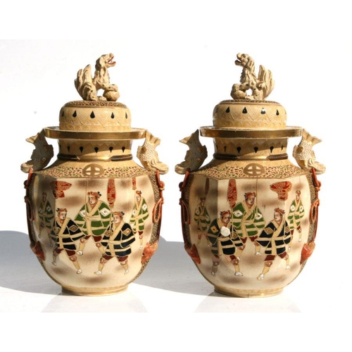 568 - A pair of late 19th / early 20th century Japanese Satsuma temple vases decorated with figures, with ... 