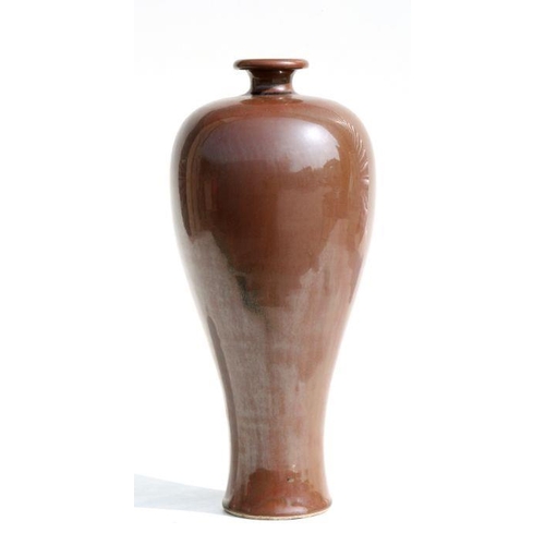 579 - A Chinese brown glazed Meiping vase with incised mark to the underside, 30cms high.