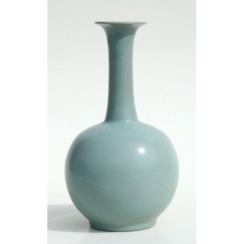 580 - A Chinese celadon crackle glazed vase, 26cms high.