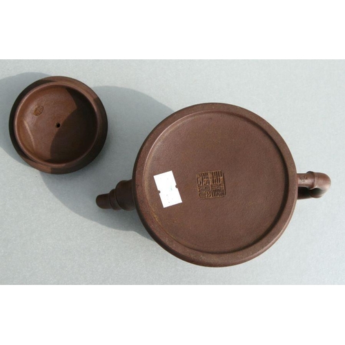 583 - A Chinese Yixing pottery teapot with stylised bamboo spout and handle, impressed seal mark to the un... 