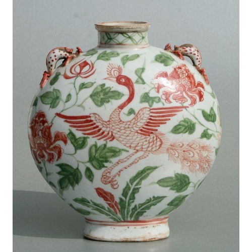 587 - A Chinese moon flask decorated with birds amongst flowers, 23cms high.