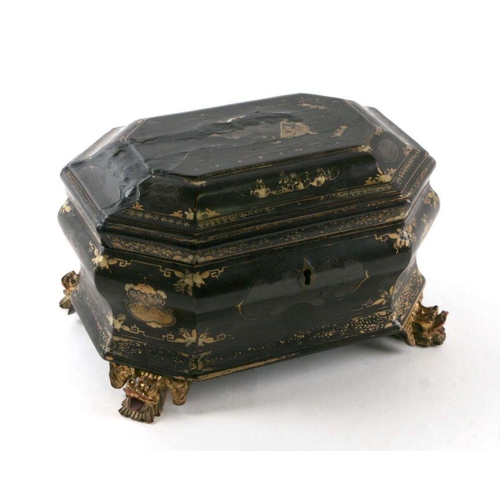 597 - A Chinese lacquer two-division tea caddy decorated with gilded figures on a black ground with lion m... 